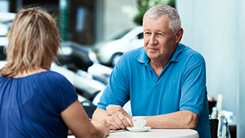 Man in conversation with woman